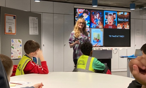 Speaker at Brunel University talking to children